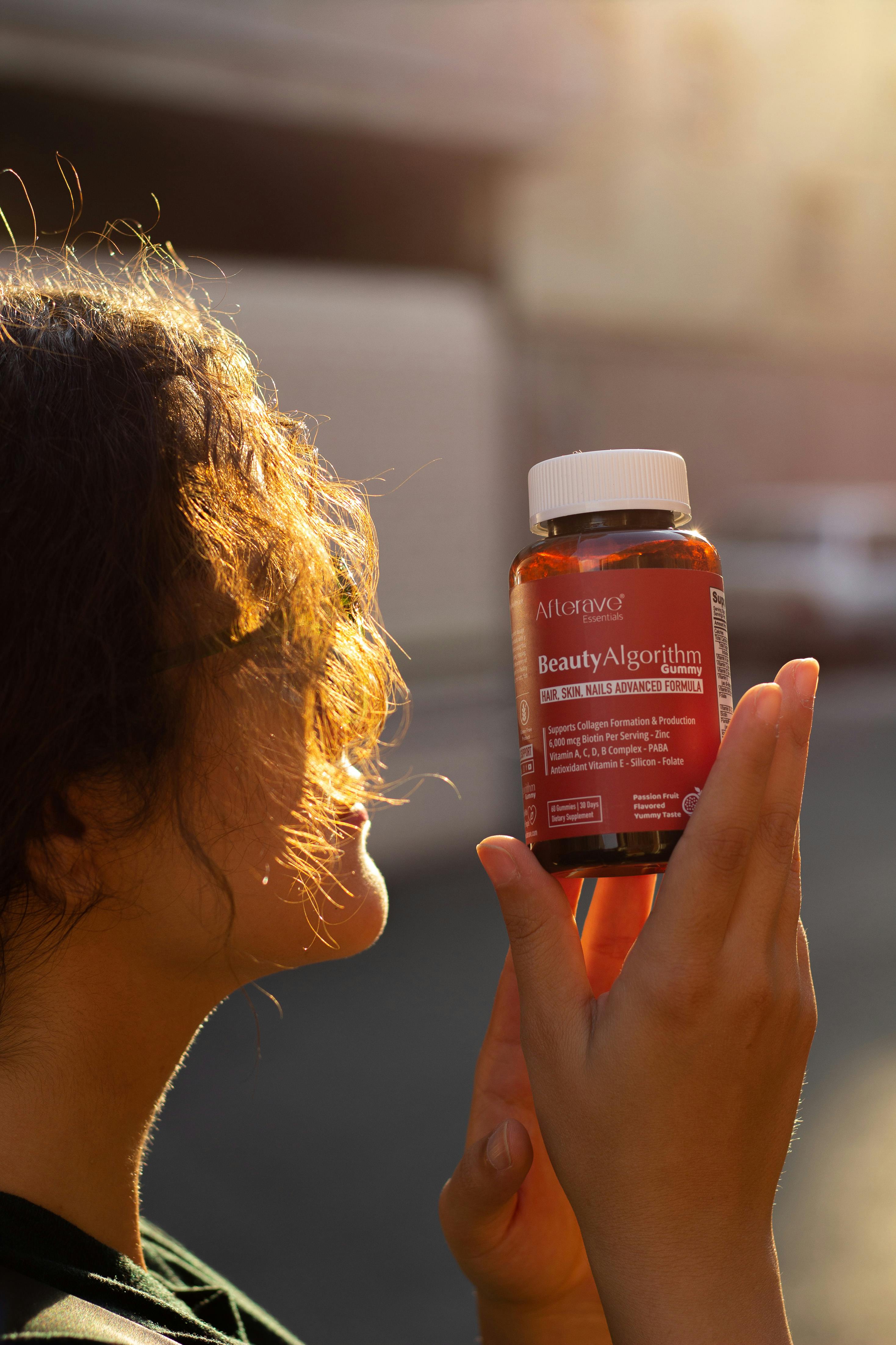 Woman 45+ awake at night holding Magnesium Recovery Plus